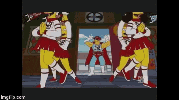 a group of cheerleaders are dancing in front of a man in a cape with the word def on it