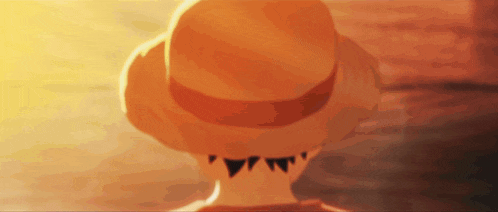 a close up of a person wearing a hat with a triangle on it