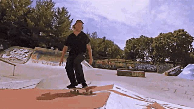 a skateboarder is doing a trick at a skate park with a sign that says " the weed " on it