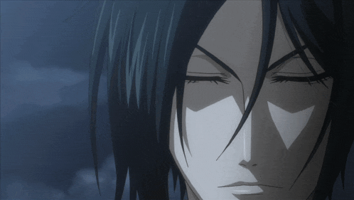 a close up of a person 's face with closed eyes