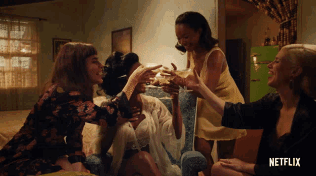 a netflix ad shows a group of women sitting on a bed