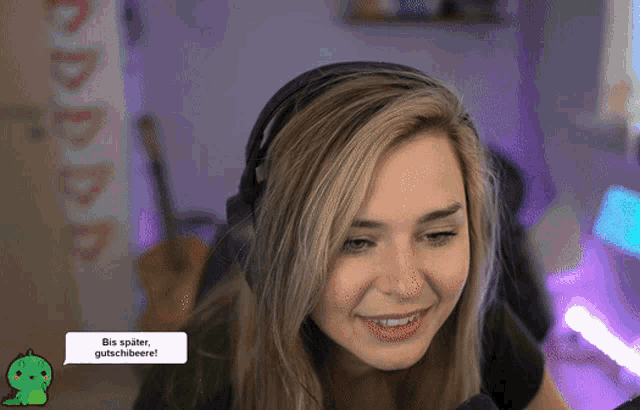 a woman wearing headphones has a speech bubble that says bis später gutschibeere