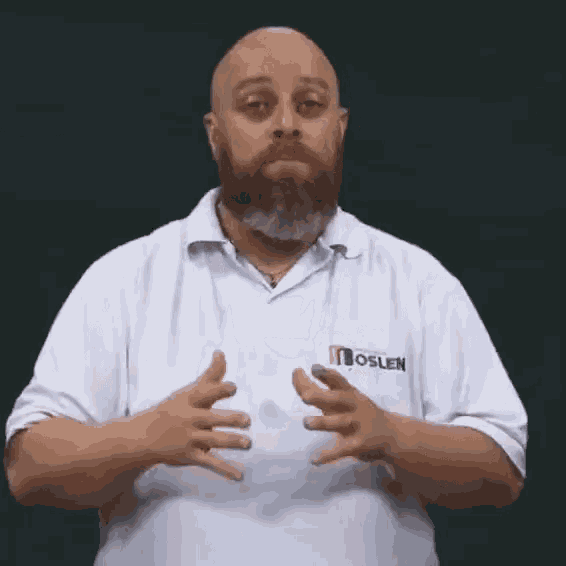 a bald man with a beard wearing a white shirt that says moslen on it