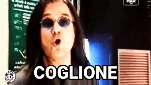 a woman wearing sunglasses says " coglione " in a video