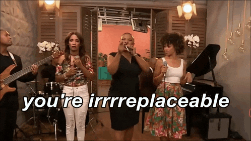 a group of women singing with the words " you 're irreplaceable " behind them