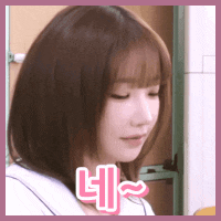 a close up of a woman 's face with a pink sticker that says ' i ' on it