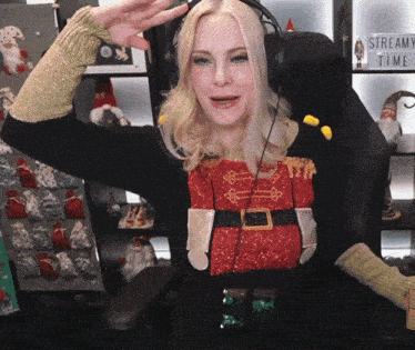 a woman sitting in a chair with a sign that says stream time on it