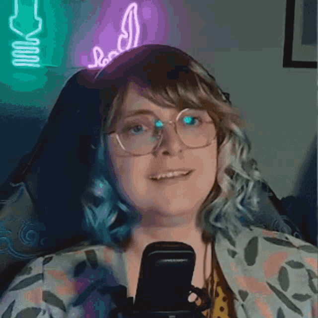 a woman wearing glasses and a headband that says ' bad '