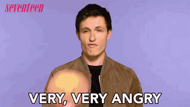 a man says very very angry in front of a purple background