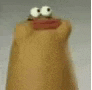 a close up of a cartoon character with big eyes and a big mouth .