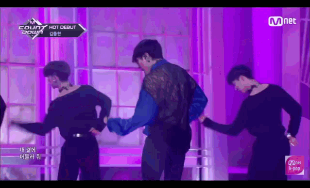 a group of men are dancing on a stage with the words count down on the bottom right