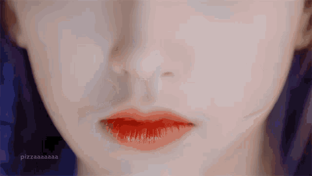 a close up of a woman 's lips with the words pizzaaaaaa written below it