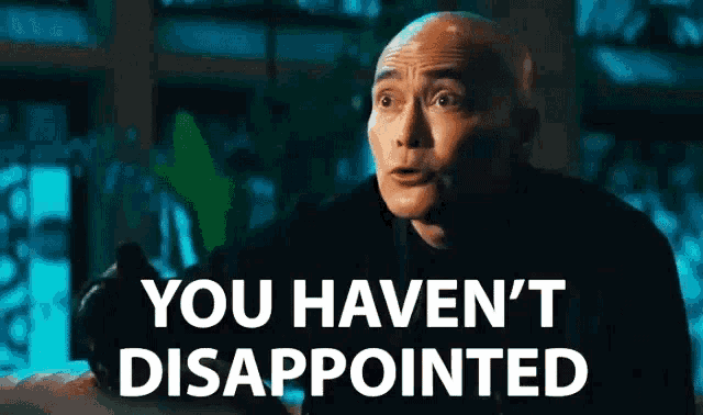 a bald man is saying `` you haven 't disappointed '' while holding a camera .