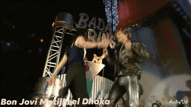 a video of bon jovi performing with the words bad ring behind them