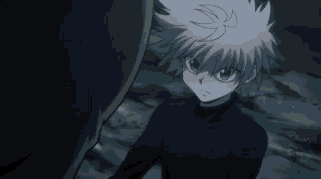 a boy with white hair and blue eyes is standing next to a person