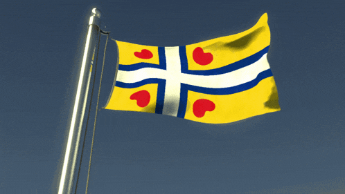 a yellow and blue flag with hearts on it is flying in the wind