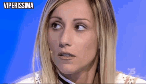 a close up of a woman 's face with the words viperissima on the bottom right