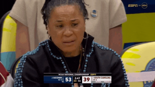 a woman is crying during a ncaa national championship game