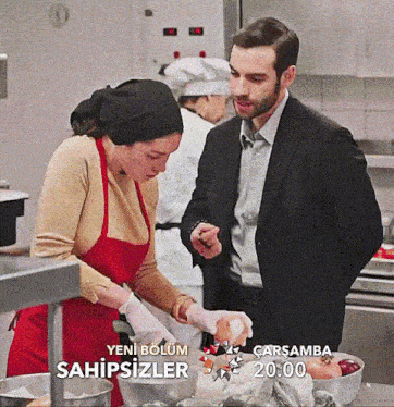 a man in a suit and a woman in an apron are preparing food in a kitchen with a sign that says sahipsizler