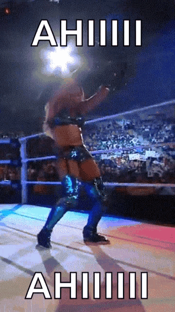 a woman in a wrestling ring with a caption that says " ahiiii "