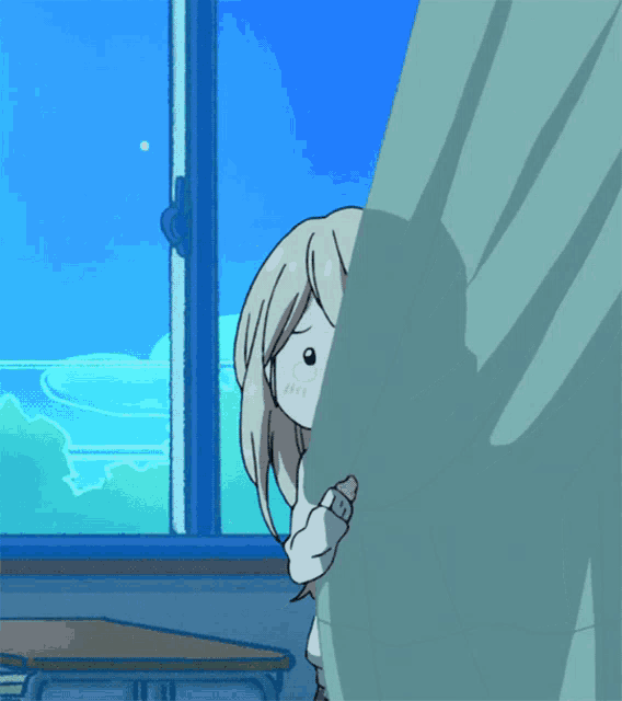 a girl peeking out from behind a green curtain in front of a window