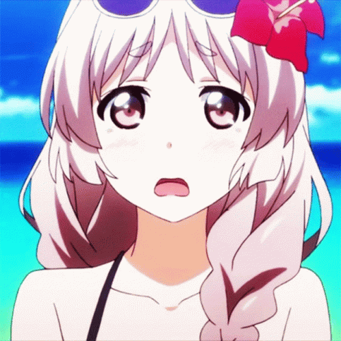 a girl with sunglasses and a flower in her hair