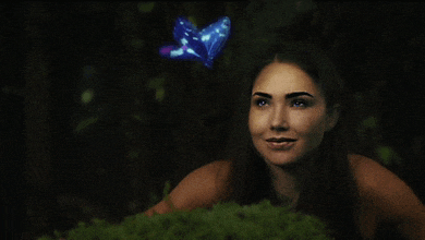 a woman with a butterfly on her head