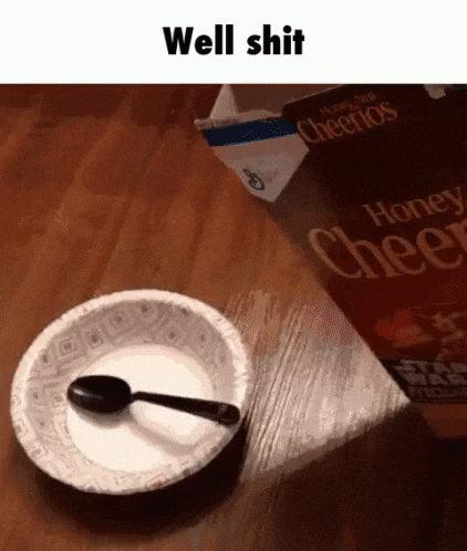 a paper plate with a spoon in it next to a box of honey cheerios