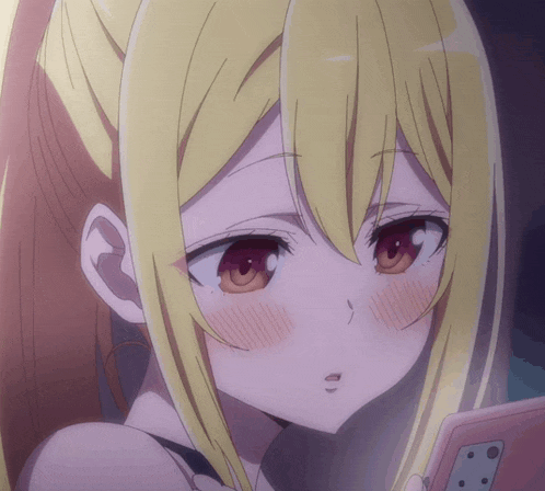 a girl with blonde hair and red eyes is looking at a phone