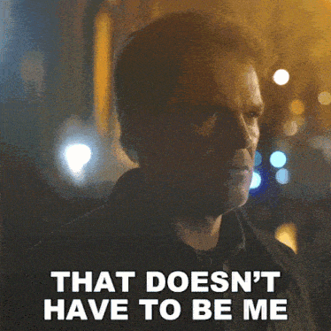 a man says that does n't have to be me in front of a blurry background