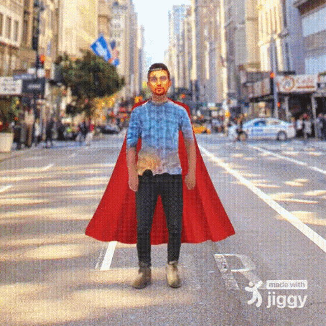 a man wearing a red cape is standing on a street with the words made with jiggy below him