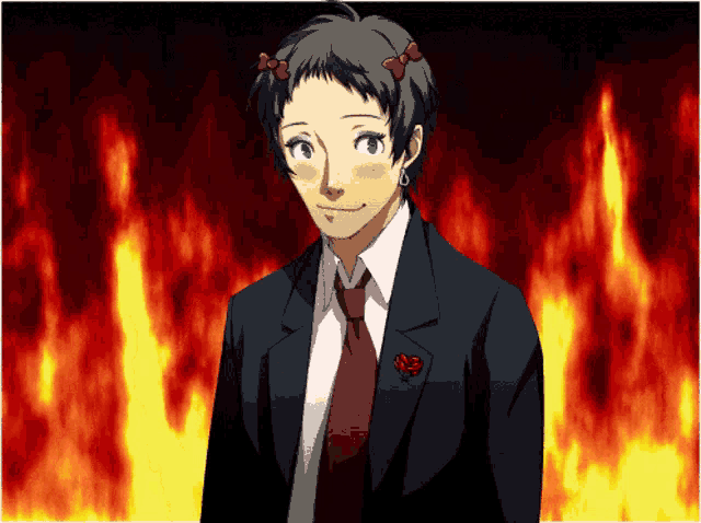 a man in a suit and tie with a red rose on his pocket