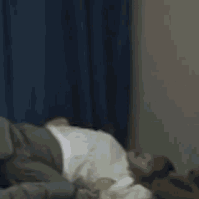 a person laying on a bed with chinese writing on the bottom