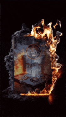 a hot wheels logo is surrounded by fire and smoke