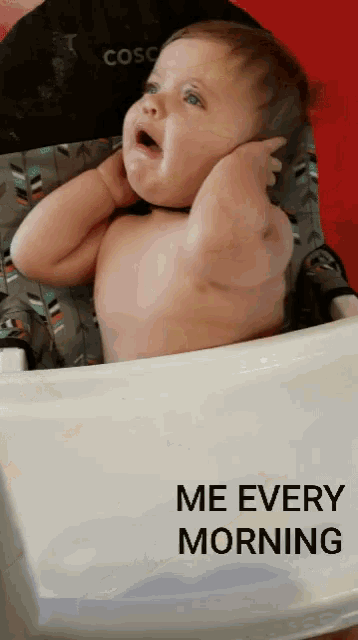 a baby sitting in a high chair with the words " me every morning " on the back