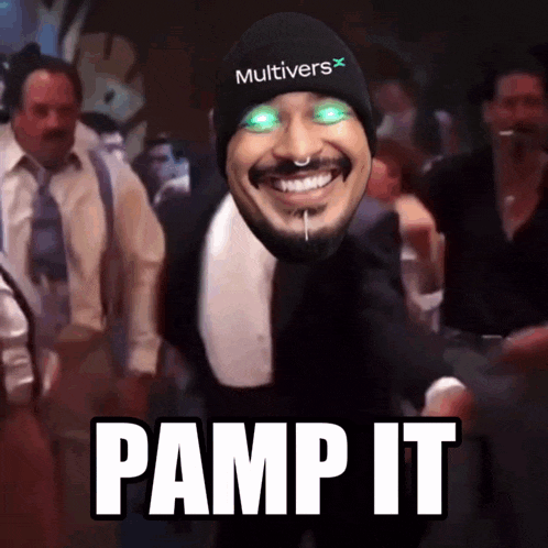 a man wearing a beanie that says multiverse pumps it