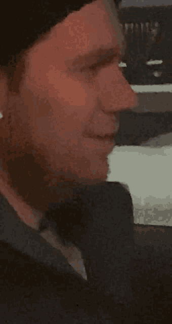 a man 's face is shown in a blurry photo