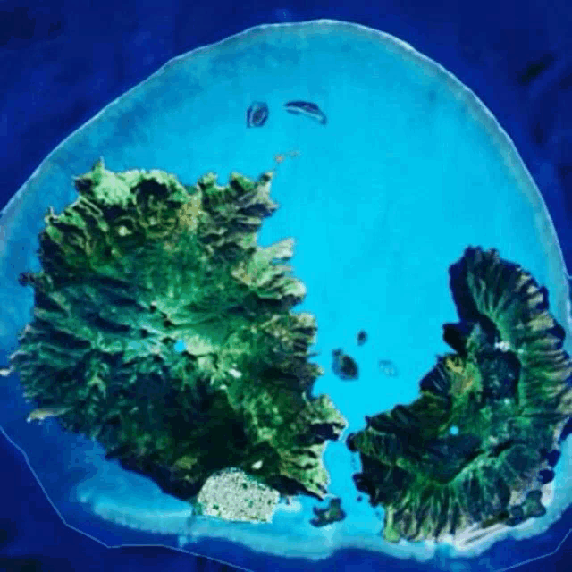 an aerial view of a small island in the middle of a large body of water