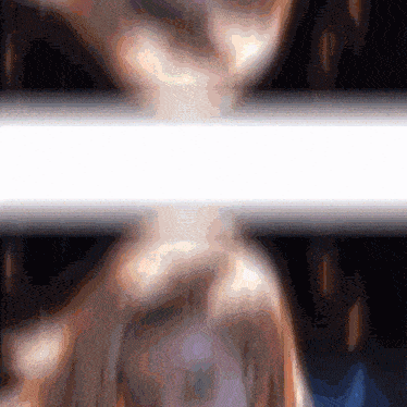 a blurred image of a person 's face with a white border