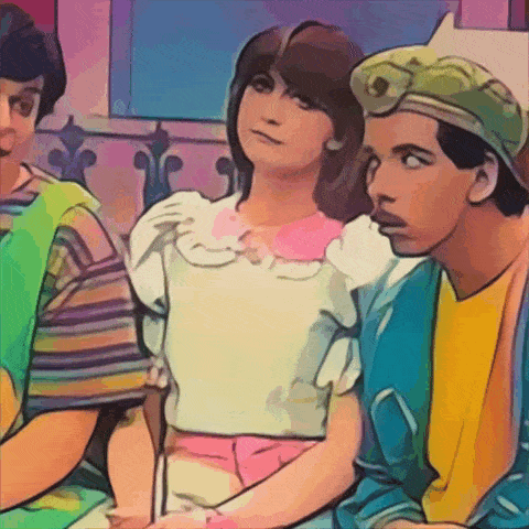 a girl in a white top sits next to a boy in a blue shirt