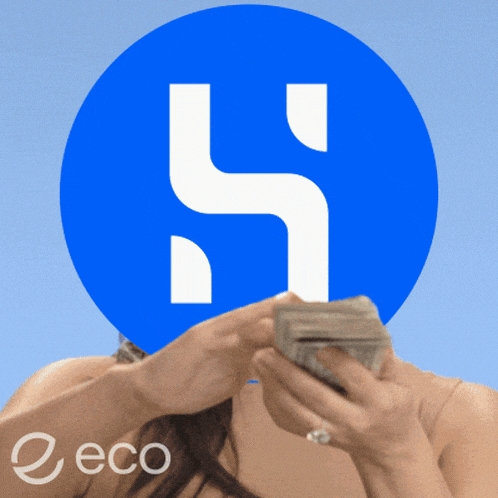 a woman holding a pile of money in front of a blue circle with the letter h on it