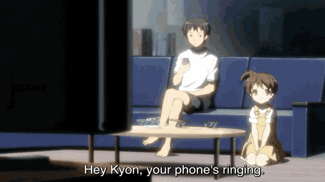 a man sits on a couch next to a little girl who says hey kyon your phone 's ringing ..