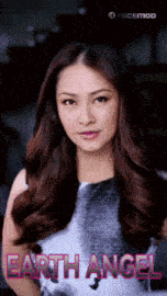 a woman in a black and white dress with earth angel written on the bottom