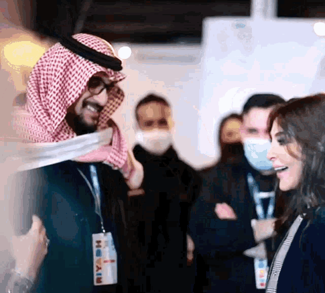 a man wearing a name tag that says riyadh on it