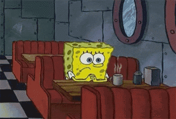 a cartoon of spongebob squarepants sitting at a table in a diner with a cup of coffee .