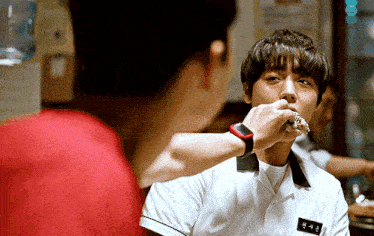 a man in a white shirt has a name tag on his chest that says ' ae '
