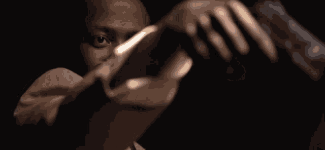 a man is holding a piece of paper in his hand