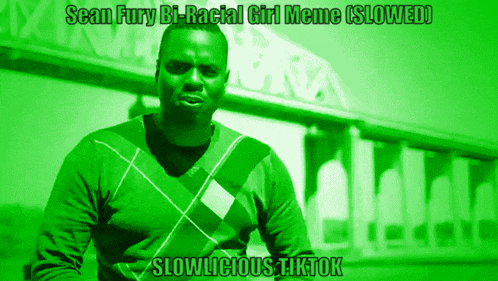a man in a green plaid sweater stands in front of a building with the words slowlicious tiktok on the bottom