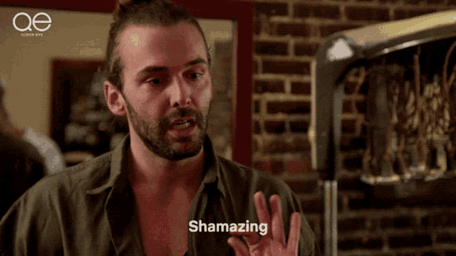 a man in a green shirt says shamazing