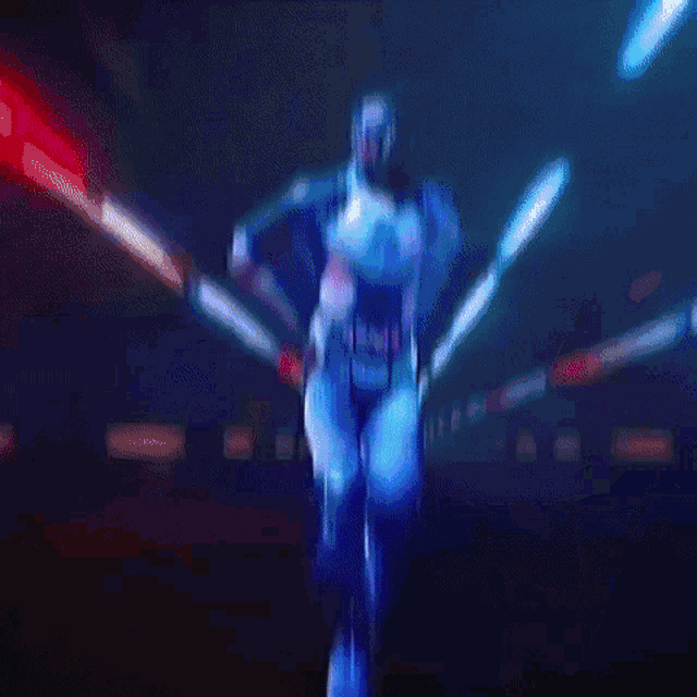 a silhouette of a man is dancing in front of a blue background .